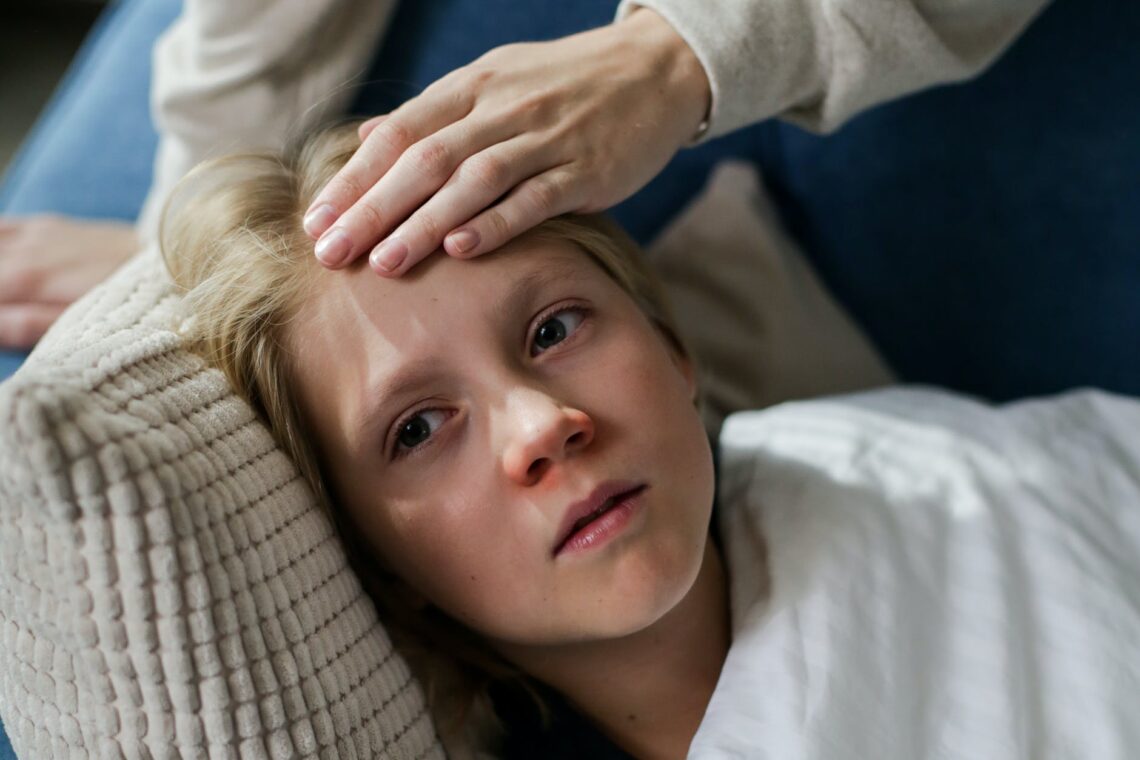 a boy lying on the couch