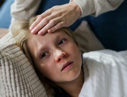 a boy lying on the couch